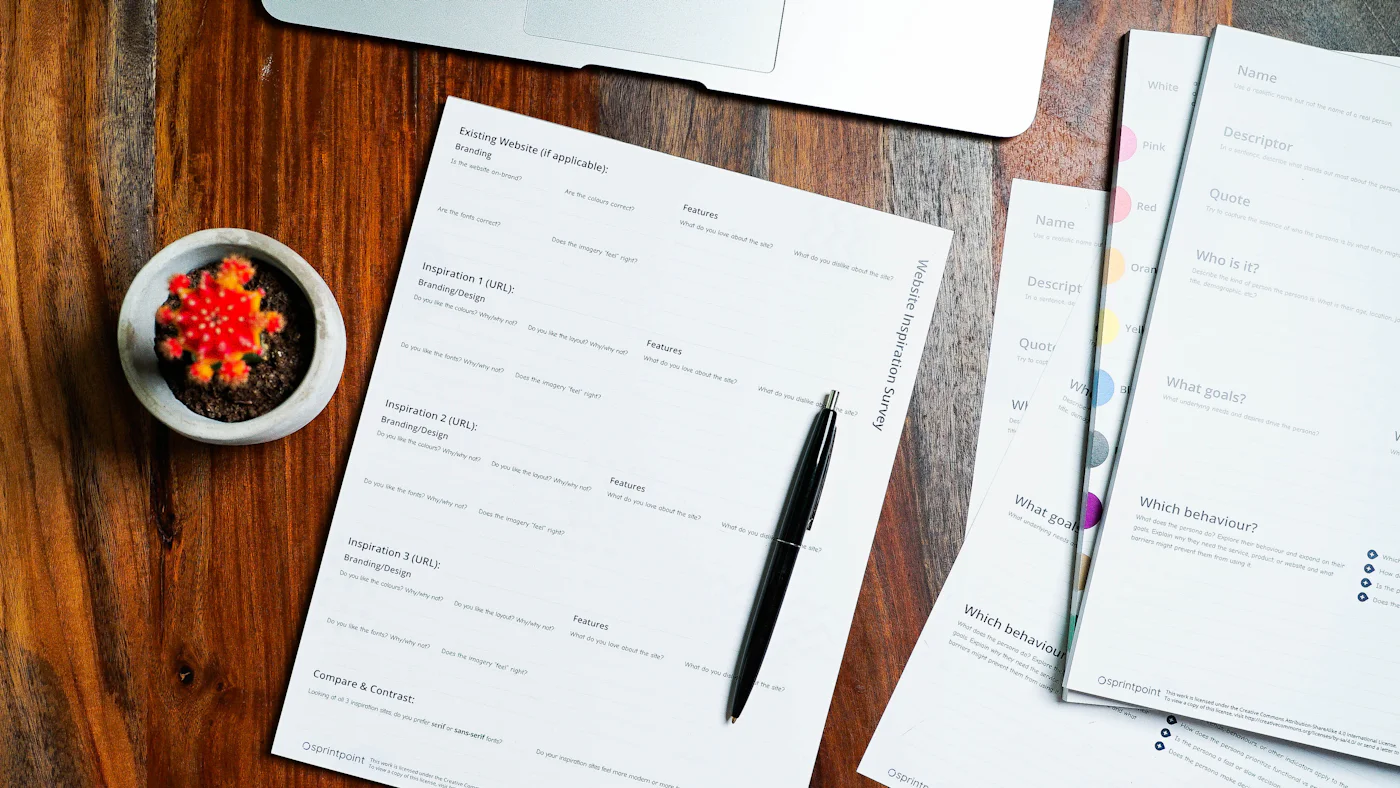 Application paperwork and a pen on a table