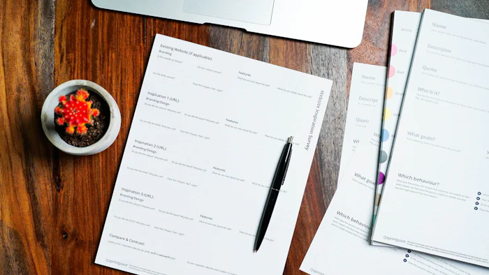 Application paperwork and a pen on a table