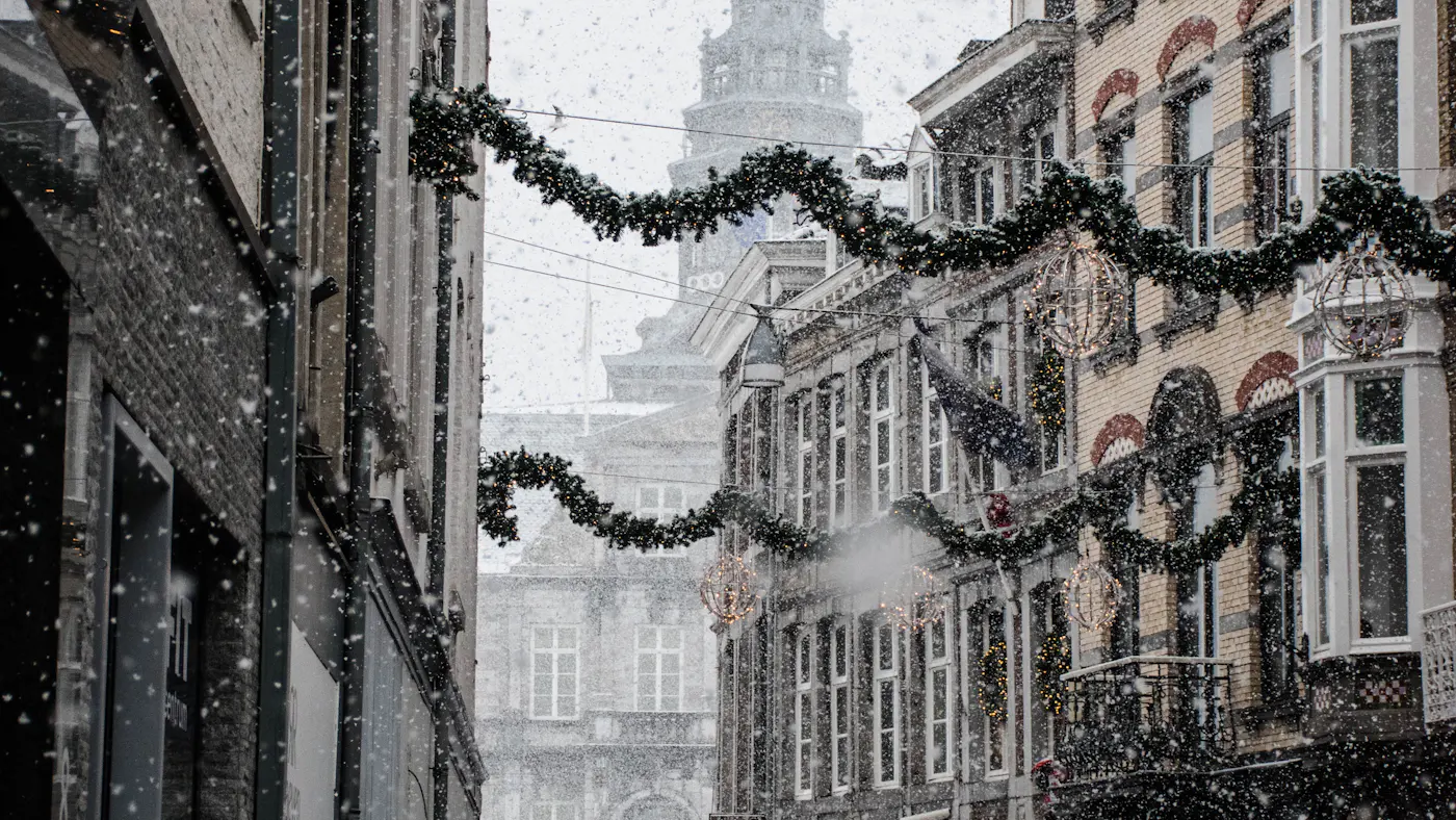 People walking a snow-covered city street in winter