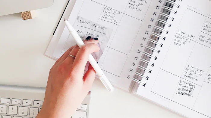 A notepad and pen on a desk, planning
